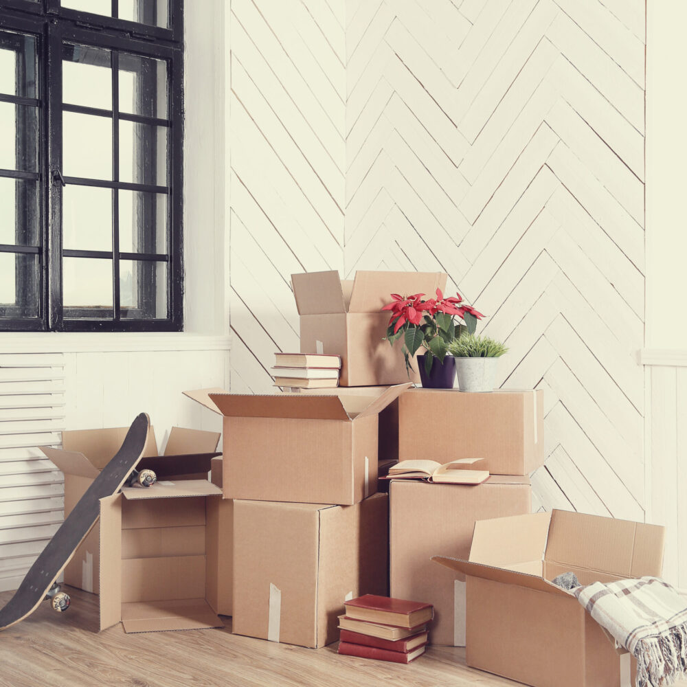 Moving home. Cardboard boxes on the floor